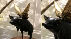 Representación de un cerdo alado sobre peana, acabado carbón negro y puntas doradas, 21cm