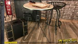 Mesa redonda de estilo industrial con base de metal y tapa de madera con incrustaciones