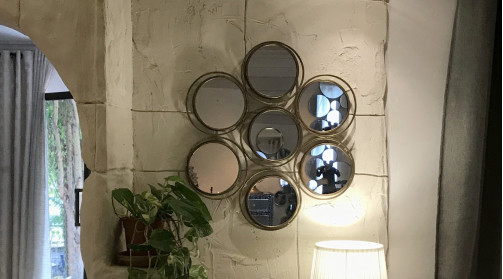 Espejo multifacético con 7 espejos secundarios redondos de metal dorado envejecido Ø 70 cm